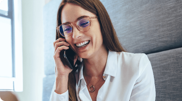 smiling woman talking on the phone